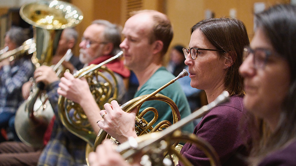 Orchestra members at a rehearsal for MADDADDAM.